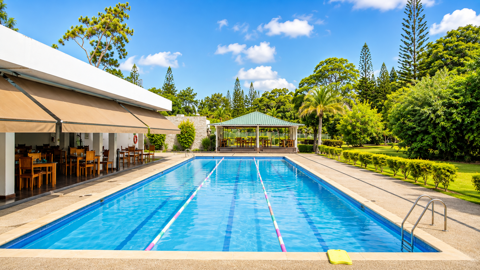 MGC outdoor swimming pool surrounded by palm trees
